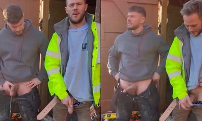 two big guys pissing together