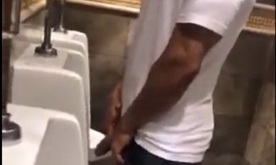 hung guy filmed by spycam while peeing at urinal