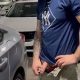 hung guy pissing in parking lot