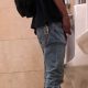 guy pulling out his dick and peeing at urinals