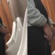 guy with big balls caught peeing at urinals