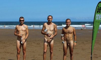 three guys naked at the beach after run competition