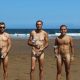 three guys naked at the beach after run competition