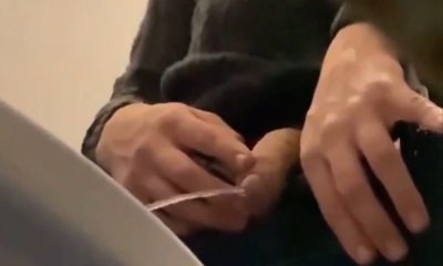 uncut dude taking a leak in a public toilet