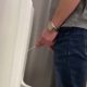 Spycam catching a man with huge fat dick peeing at urinals
