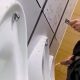 Uncut guy caught peeing while texting at the urinals