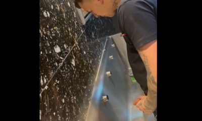 Tattooed latin guy with huge uncut dick caught peeing at urinals