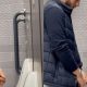 Uncut dude taking a leak at urinals