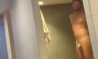 Hot tall dude showering in the gym locker room