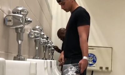 Sporty guy found peeing at urinals by spycam