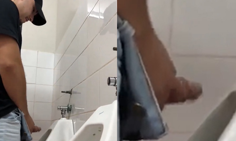 Brazilian dude shaking his big dick at urinals