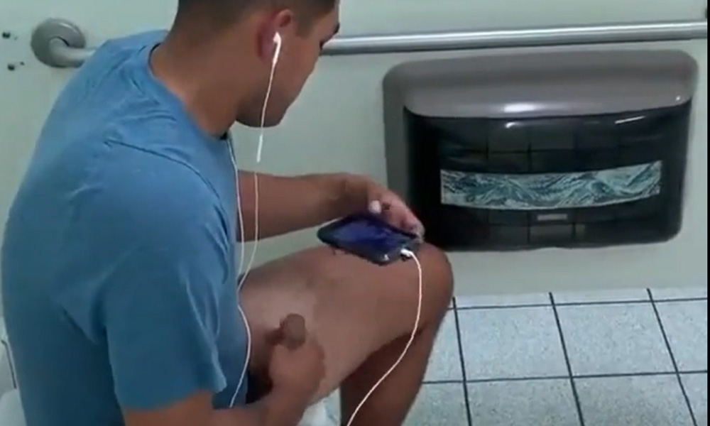 Hung uncut guy caught wanking in a public toilet