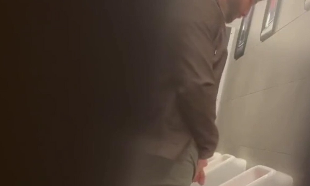 Very hung guy caught peeing at urinals