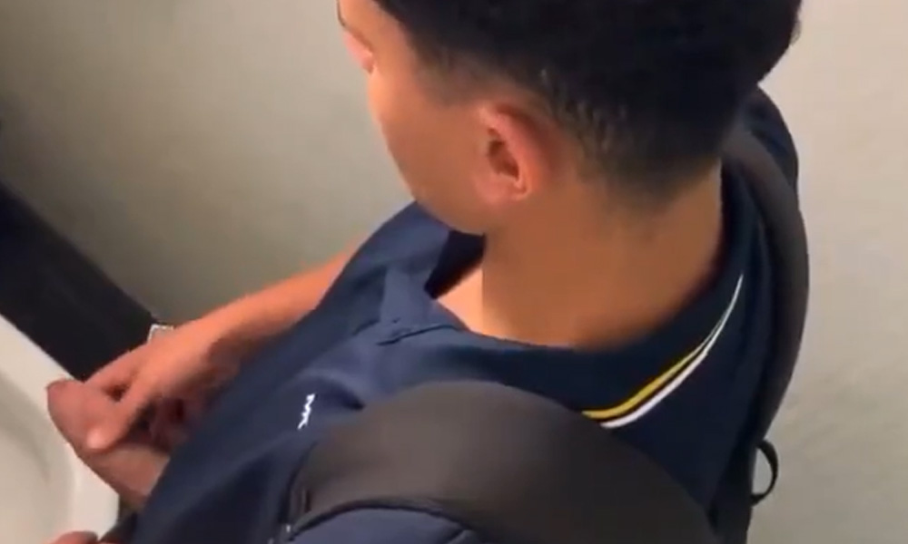 Latin guy with juicy uncut cock caught peeing in a public toilet