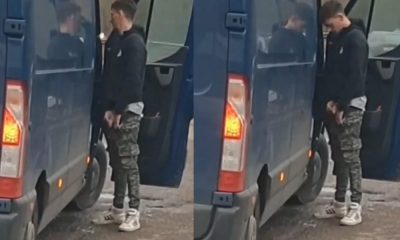 Guy caught pissing in public next to his car