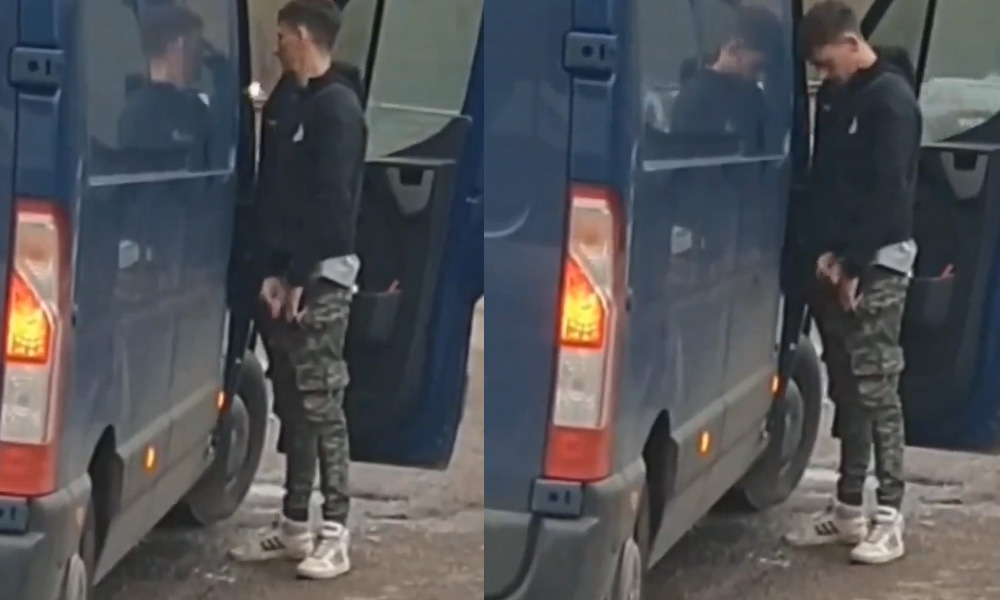 Guy caught pissing in public next to his car