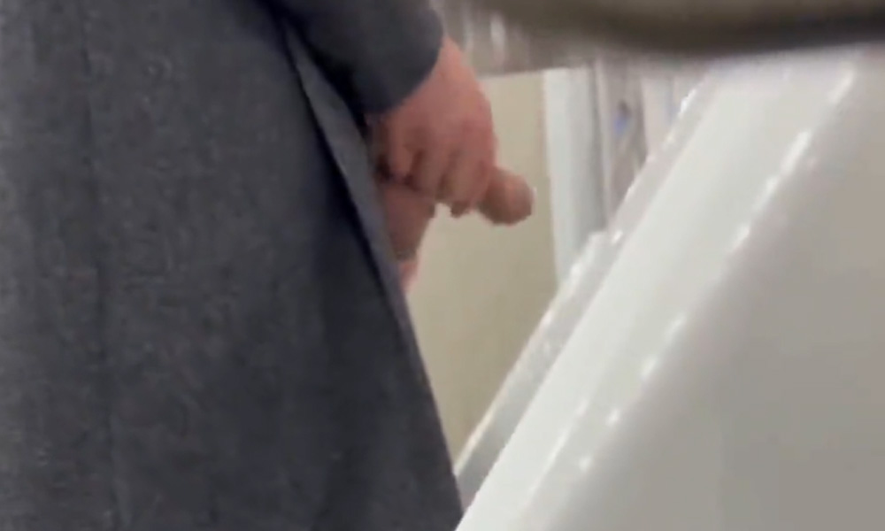 Man with enormous dick caught peeing with balls out at urinals