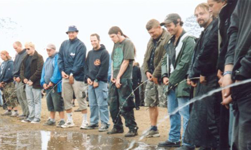 Group peeing on men