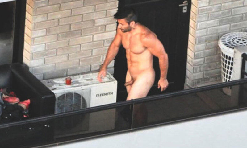 man with boner caught naked on the balcony.