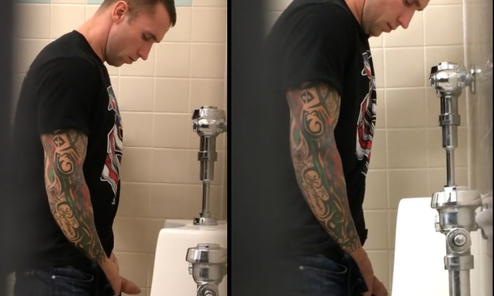 tattooed guy caught peeing at urinals