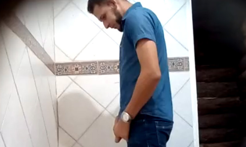 latin guy caught peeing at the urinals