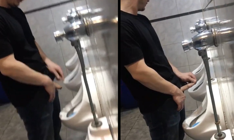 guy peeing and stretching his foresking at urinal