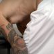 tattooed footballer caught undressing in locker room