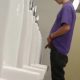 guy peeing at urinal with balls and cock out