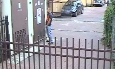 guy caught peeing in the street by surveillance camera