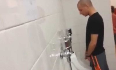hidden cam spying on guy peeing urinal