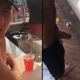 straight guy peeing behind a bar counter