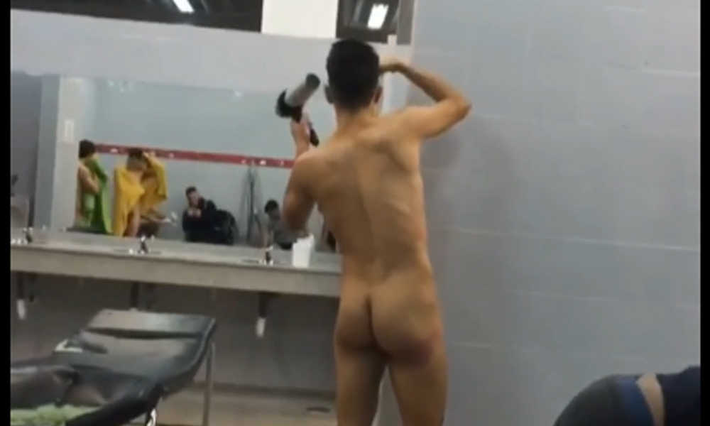 naked footballer blowing hair in locker room