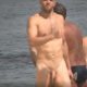 sexy man caught naked over nudist beach