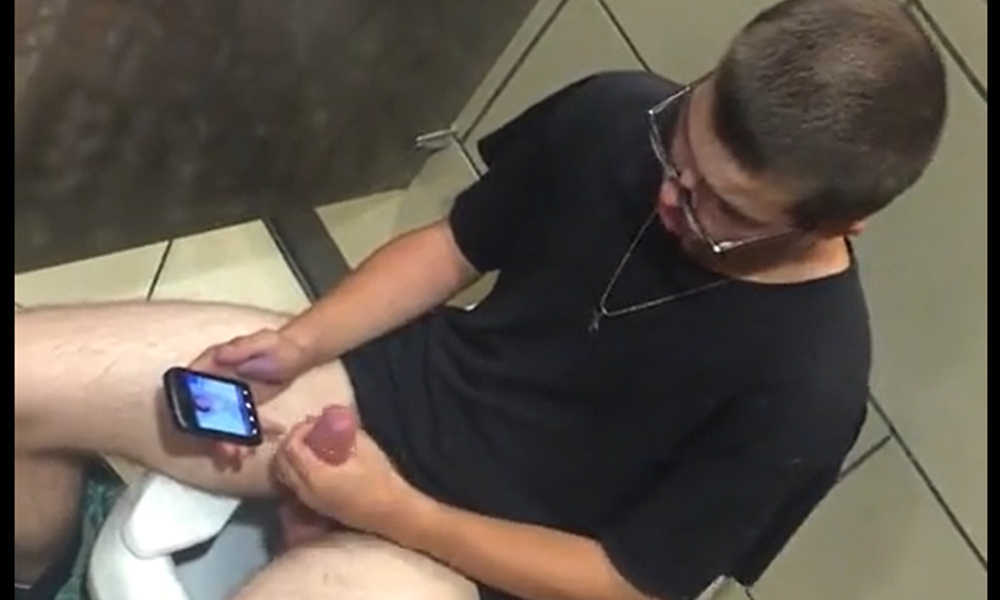 guy in glasses caught wanking in public toilet