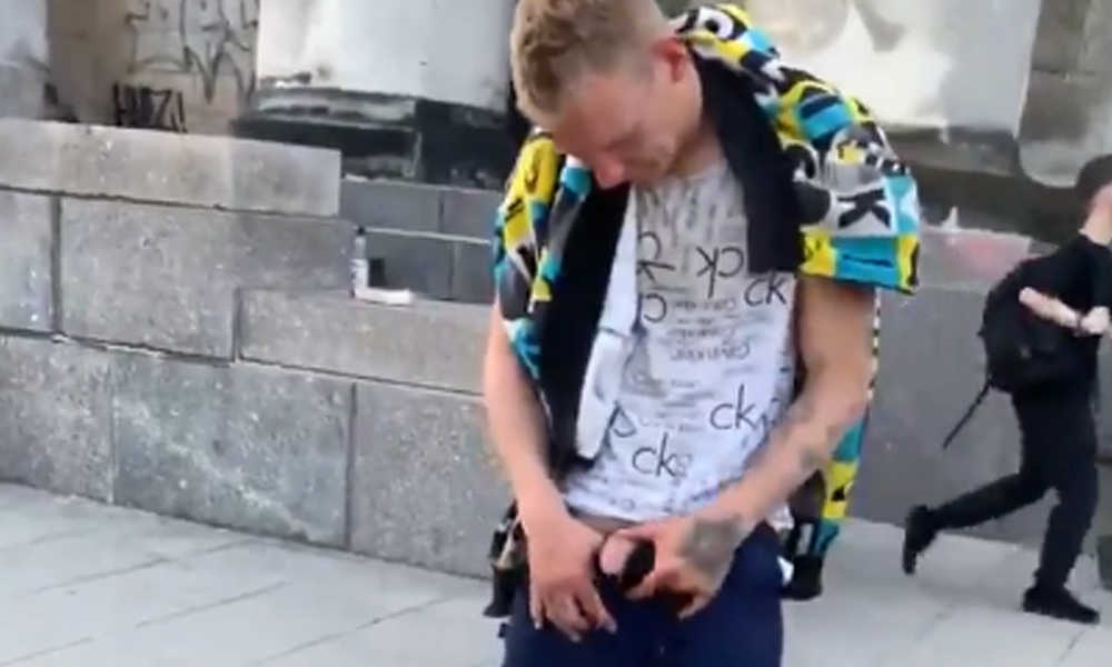 drunk guy caught peeing in public in front of people