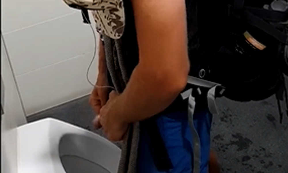 german guy caught peeing at urinals