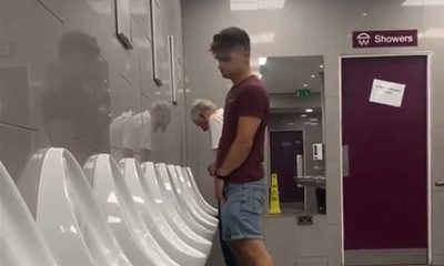 spying on a guy peeing at urinals