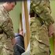 hung military man caught peeing at urinals