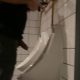 uncut man caught peeing hands free at the urinals