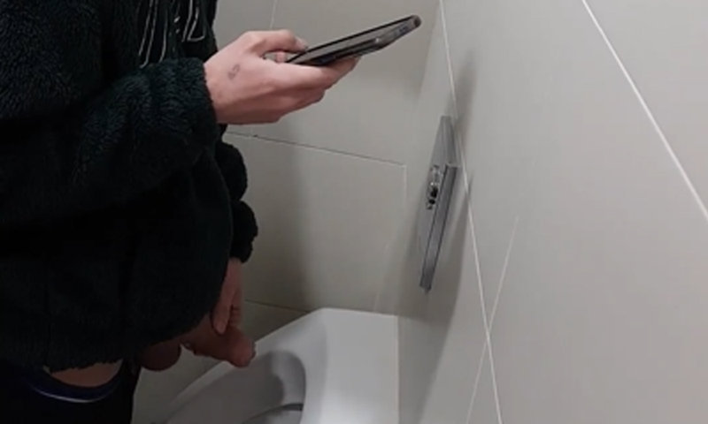 Spanish guy peeing and getting a boner at urinals