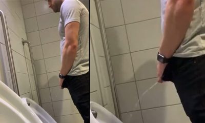 guy peeing and shaking his dick several times at urinals
