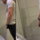 guy peeing and shaking his dick several times at urinals