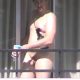 man caught getting out totally naked on the balcony