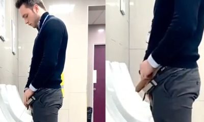 uncut guy in suit caught peeing at the urinals