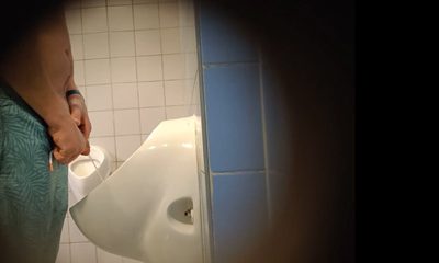man peeing and shaking his big cock at pool urinals