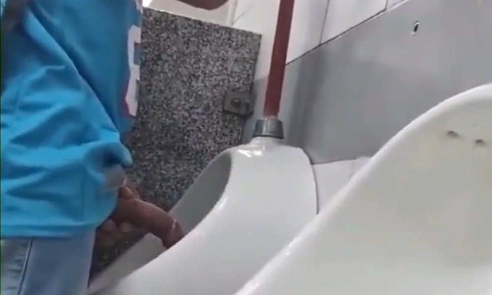 guy showing off his boner at urinals