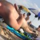 man getting a boner while sunbathing at nudist beach