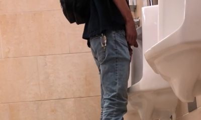 guy pulling out his dick and peeing at urinals