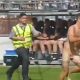 Completely naked streaker on football pitch