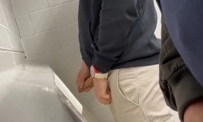 Hung uncut guy caught taking a leak at the urinals